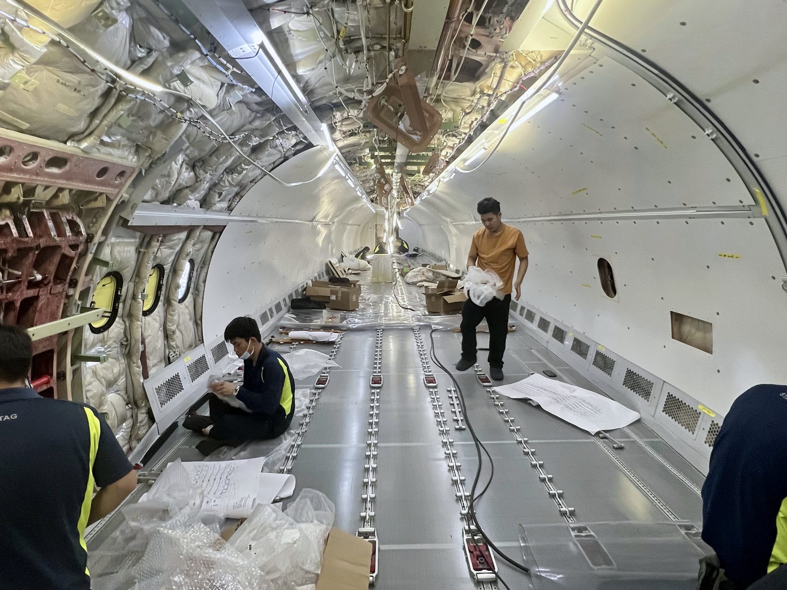 Engineers reviewing aircraft records and documentation on site